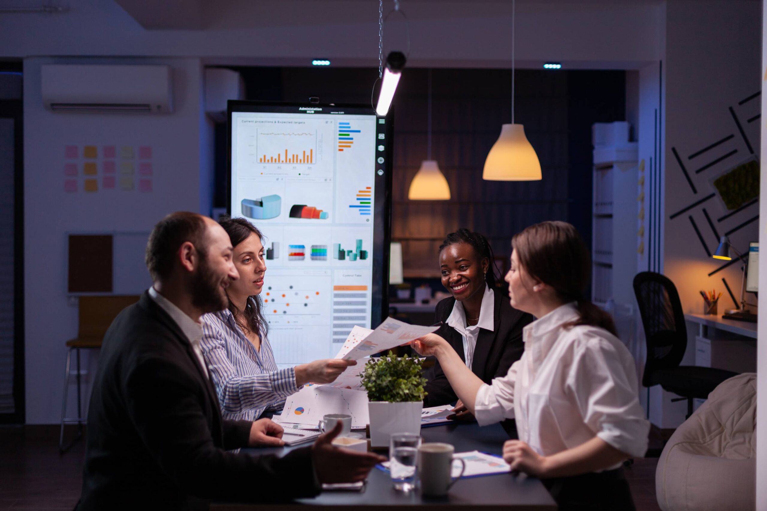 workaholics-businesspeople-brainstorming-financial-company-ideas-analyzing-strategy-paperwork-late-night-business-office-meeting-room (1)
